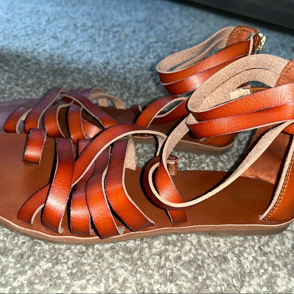 Brown gladiator sandals.